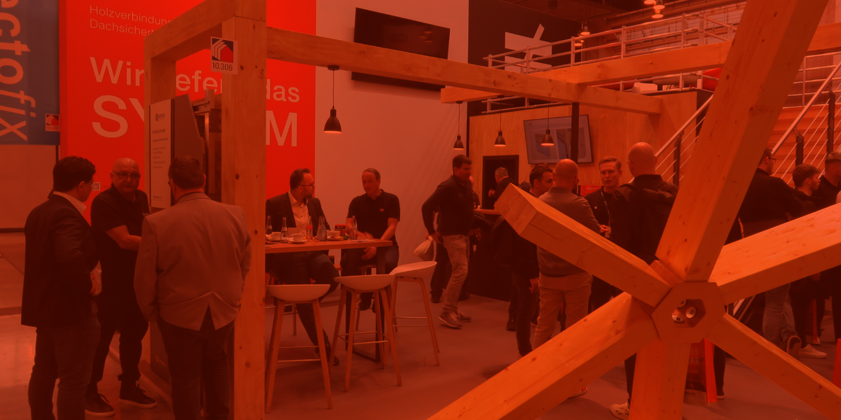 a group of people at a stand at a fair.